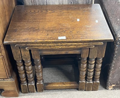 Lot 557 - Nest of three oak occasional tables, largest...