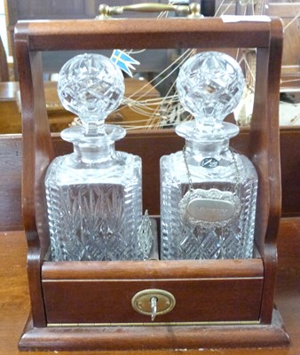 Lot 561 - Reproduction two-bottle Tantalus with hardwood...