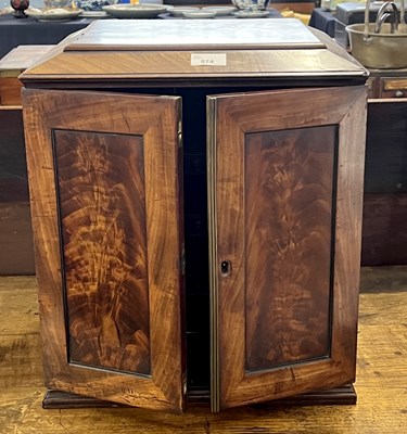 Lot 574 - Georgian mahogany table top cabinet with two...