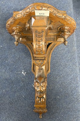 Lot 613 - Victorian carved oak Gothic style wall bracket...