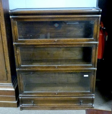 Lot 621 - Globe Wernicke oak sectional bookcase cabinet...