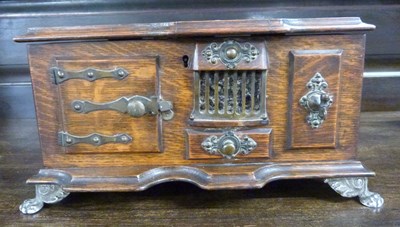 Lot 629 - Unusual oak cigarette box formed as a cooking...