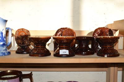 Lot 654 - QUANTITY OF TREACLE GLAZED PLINTHS AND LIONS