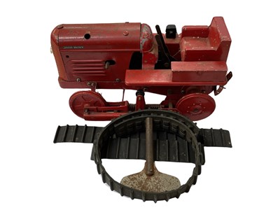 Lot 74 - A die-cast clockwork David Brown tractor toy,...