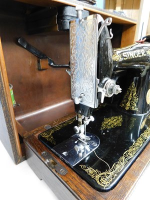 Lot 16 - A c.1934 knee operated Singer sewing machine,...