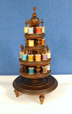 Lot 3 - A 19th century fruitwood four tier cotton reel...