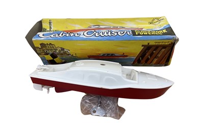 Lot 107 - A boxed Welso Toys clockwork Cabin Cruiser...