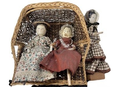 Lot 224 - A trio of early 20th century wooden doll...