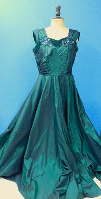 Lot 63 - An emerald green satin evening gown with...