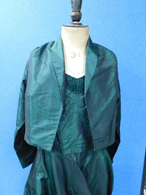Lot 42 - An emerald green satin evening gown with...