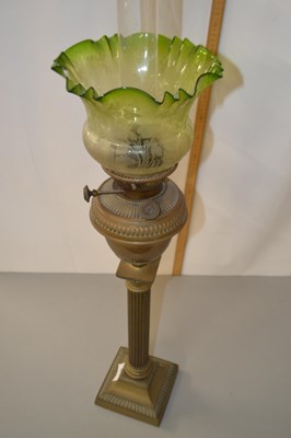 Lot 4 - Brass based oil lamp with frilled green glass...