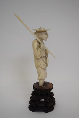 Lot 7 - Ivory okimono figure of a fisherman, Meiji...