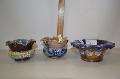 Lot 42 - Four small Doulton vases with frilled rims