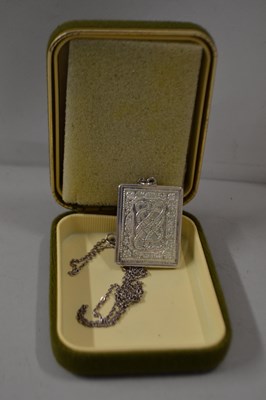 Lot 88 - Rectangular silver pendant decorated with a...