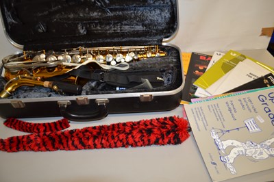 Lot 99 - Conn 20M saxophone with case and various music...