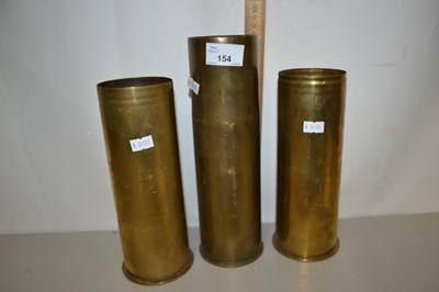 Lot 154 - Three brass shell cases