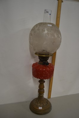 Lot 158 - Oil lamp with red glass font