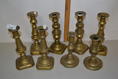 Lot 159 - Group of eight brass candlesticks