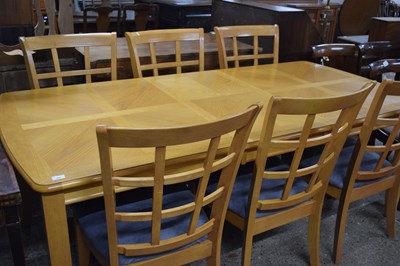 Lot 269 - Modern oak extending dining table and six mesh...