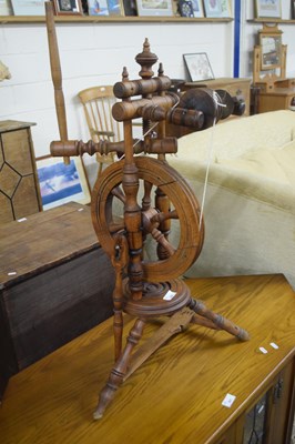 Lot 302 - An antique turned wooden spinning wheel