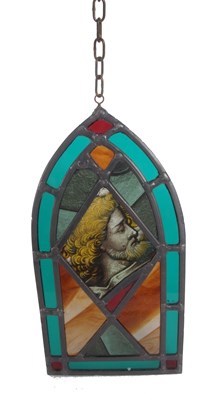 Lot 28 - A stained and leaded glass panel in the form...
