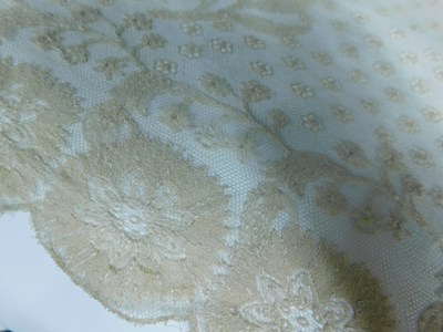 Lot 22 - A Nottingham lace shawl with scalloped floral...