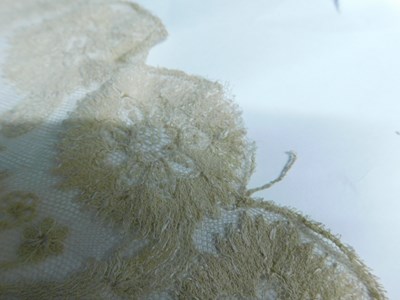 Lot 22 - A Nottingham lace shawl with scalloped floral...