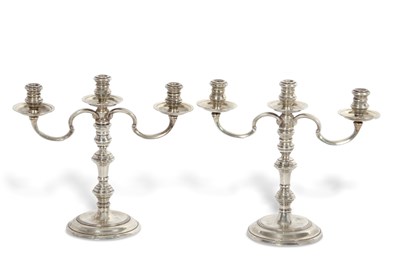 Lot 266 - A pair of small silver three light candelabra...