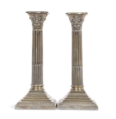 Lot 270 - A pair of late Victorian silver candlesticks...