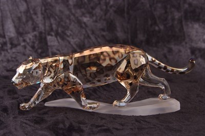 Lot 5 - A Swarovski model of a leopard on shaped...