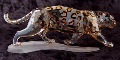 Lot 5 - A Swarovski model of a leopard on shaped...