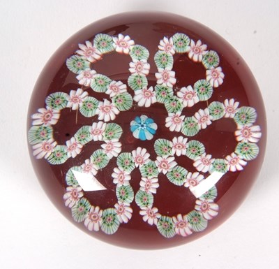 Lot 17 - A Clichy paperweight with a garland of flowers