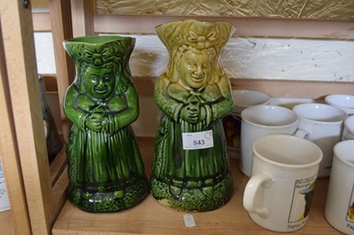 Lot 643 - TWO 19TH CENTURY GREEN GLAZED JUGS FORMED AS...