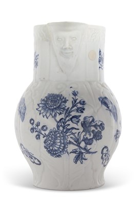 Lot 91 - A rare Lowestoft mask jug decorated in blue...