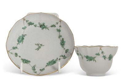 Lot 101 - A Bristol porcelain tea bowl and saucer, the...