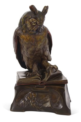 Lot 106 - A ceramic model of a "Wise Owl" perched on an...