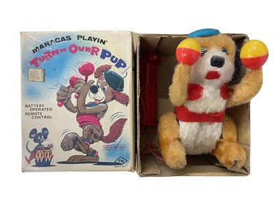 Lot 327 - A boxed Maracas playin' Turn-Over-Pup by...