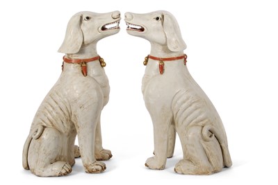 Lot 122 - A pair of Qing Dynasty dogs decorated in...