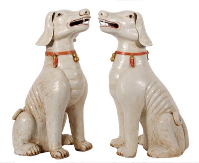 Lot 122 - A pair of Qing Dynasty dogs decorated in...