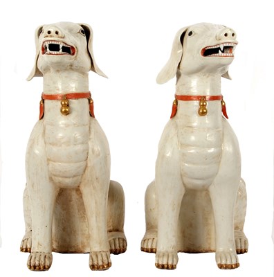 Lot 122 - A pair of Qing Dynasty dogs decorated in...