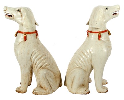 Lot 122 - A pair of Qing Dynasty dogs decorated in...