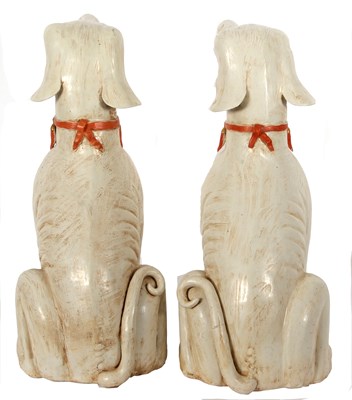 Lot 122 - A pair of Qing Dynasty dogs decorated in...