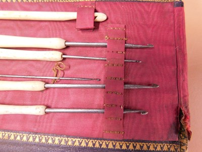 Lot 8 - A leather case of various needlework tools,...