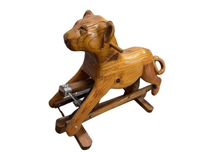 Lot 136 - A childrens' wooden rocking toy, formed as a...