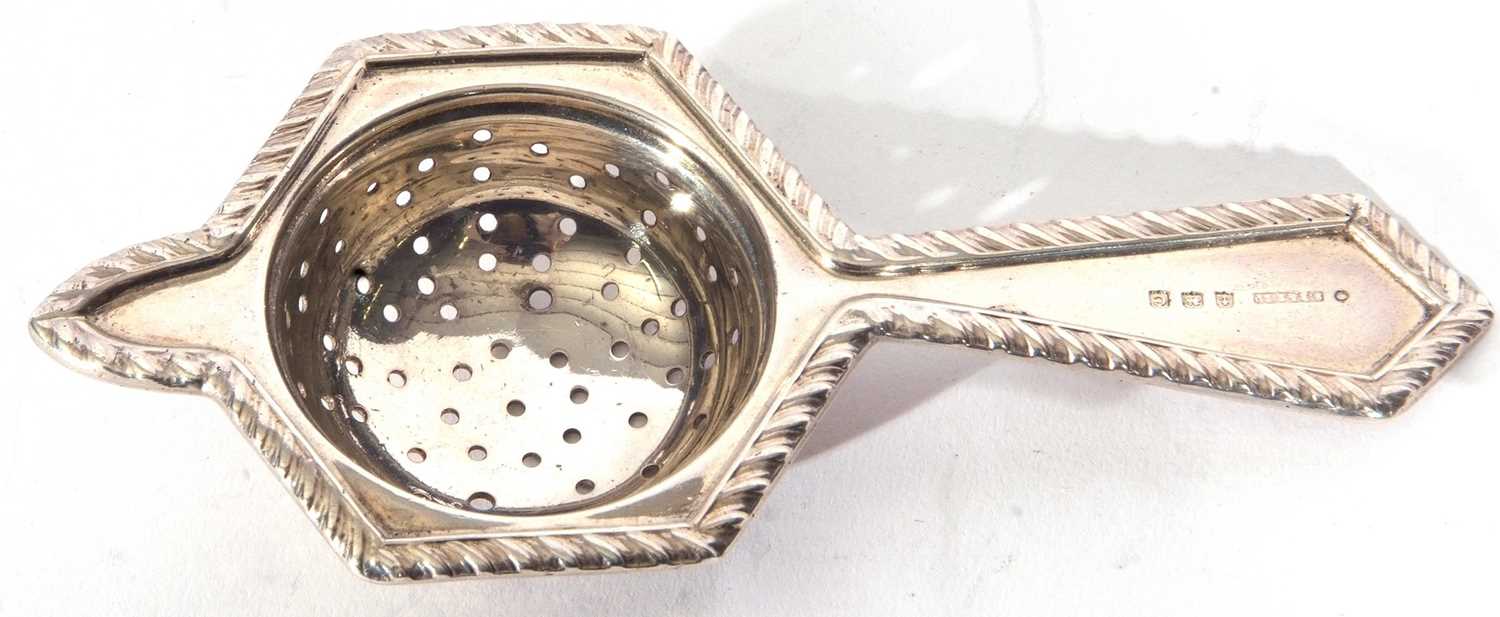 Lot 16 - George V silver tea strainer of hexagonal...