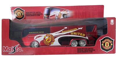Lot 60 - A boxed Maisto Manchester United team bus