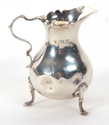 Lot 24 - A Victorian cream jug of typical form having...