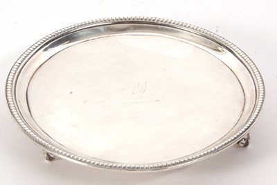 Lot 27 - A George III silver card salver having beaded...