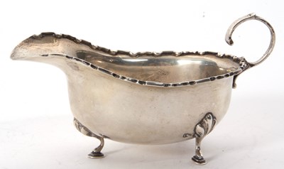 Lot 11 - A George V silver sauce boat of typical form...