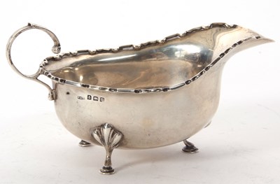 Lot 11 - A George V silver sauce boat of typical form...